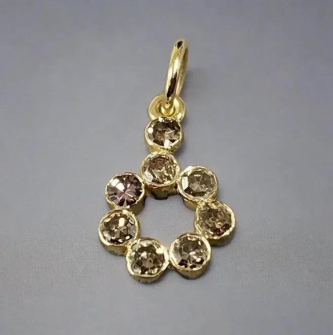 Elegant gold pendant with round champagne diamonds, perfect for luxury jewelry lovers