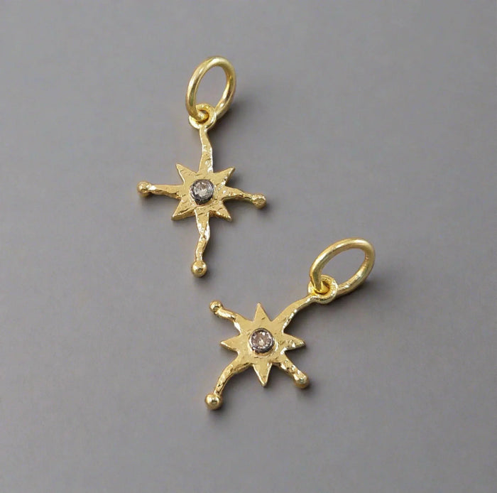 Gold star charms with diamond centers, elegant jewelry accessories