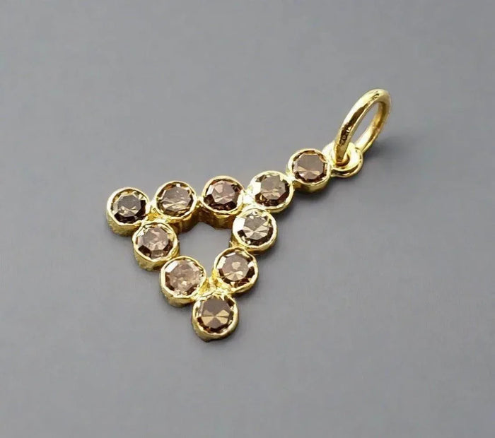 Gold pendant with brown gemstones in heart shape, elegant jewelry accessory