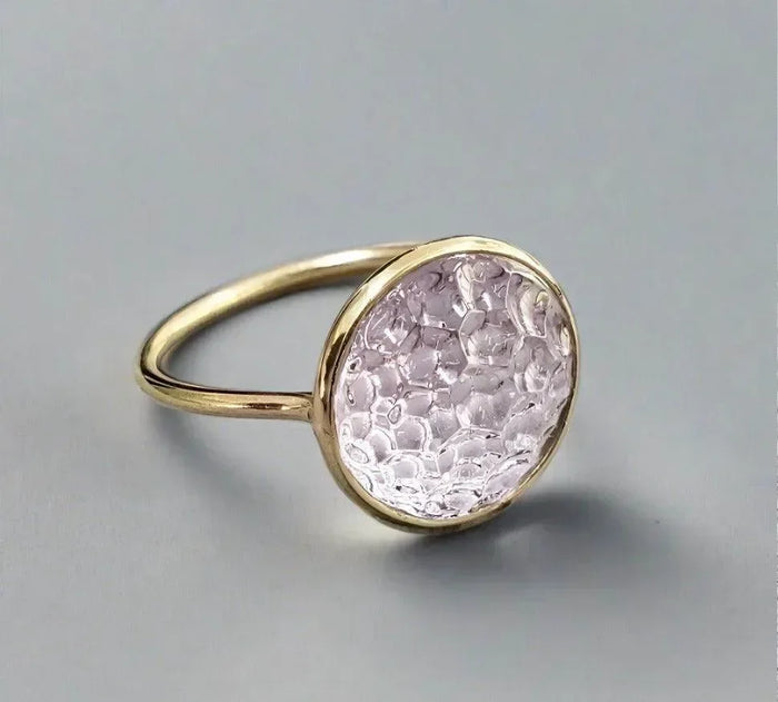 Elegant gold ring with textured pink gemstone, fine jewelry accessory