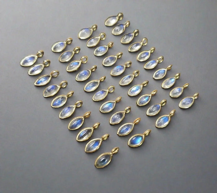 Gold-toned pendants with blue iridescent stones, elegant jewelry accessories