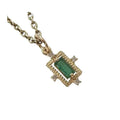 Elegant gold necklace with emerald and diamond accents, perfect for luxury jewelry lovers