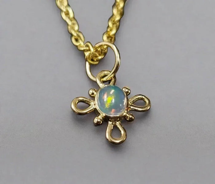 Gold flower pendant necklace with opal gemstone, elegant jewelry accessory