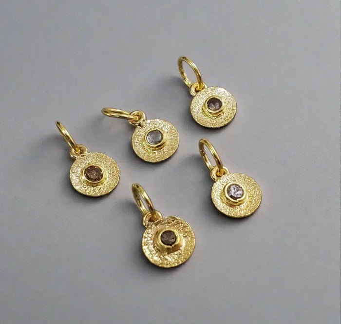 Textured gold disc charms with diamond centers, elegant jewelry accessories