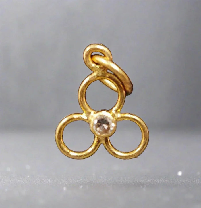 Gold clover charm with diamond center, elegant jewelry accessory
