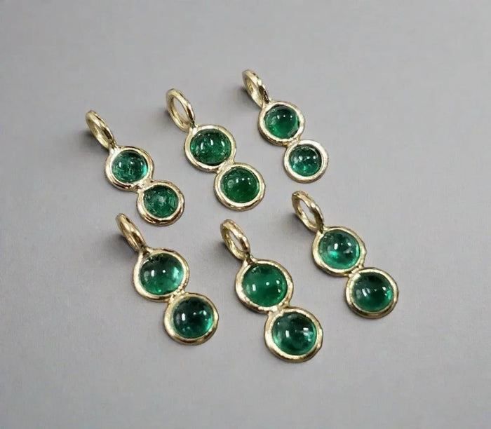 Gold double emerald gemstone pendants, elegant jewelry accessories with vibrant green stones