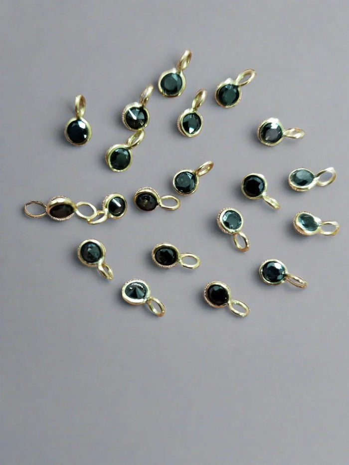 Gold pendants with black gemstones, elegant jewelry accessories for necklaces or bracelets