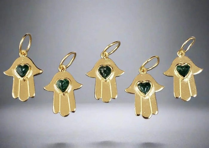 Gold Hamsa hand charms with green heart gemstones, elegant jewelry accessories