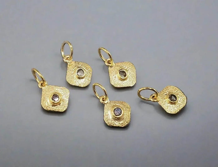 Textured gold square charms with diamond centers, elegant jewelry accessories