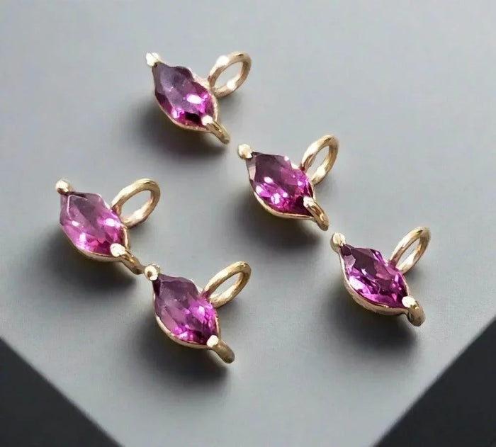 Marquise pink gemstone charms in gold setting, elegant jewelry accessories