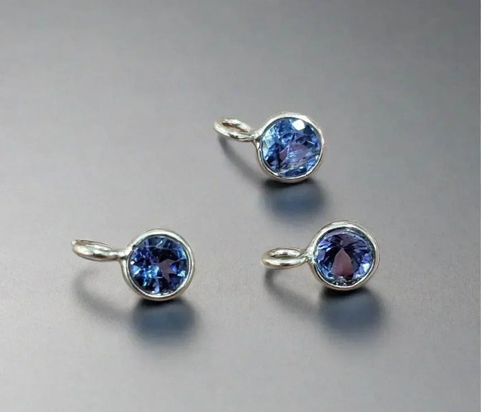 Elegant blue gemstone pendants in silver settings, perfect for luxury jewelry collections
