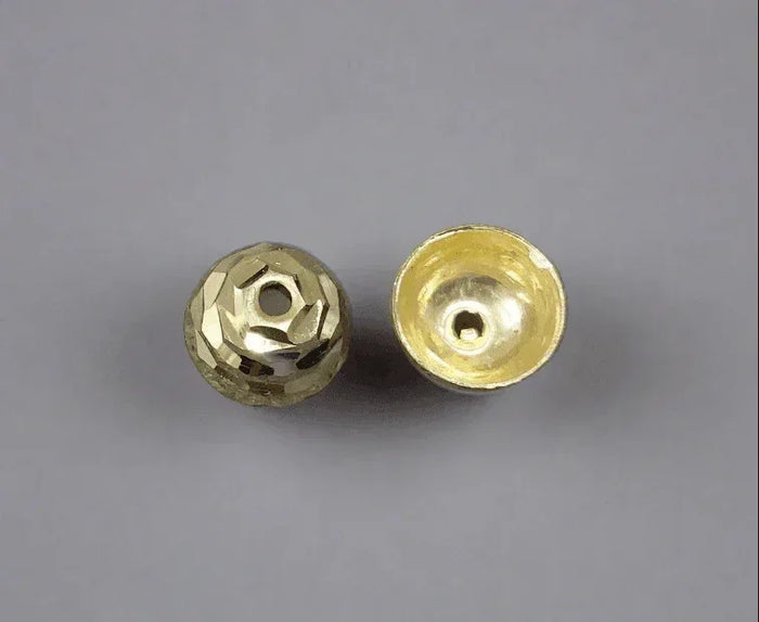 Faceted gold bead with hollow interior, ideal for elegant jewelry designs