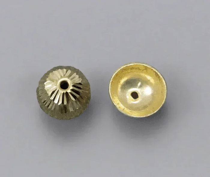 Gold-toned jewelry beads with textured and smooth finishes for elegant accessories