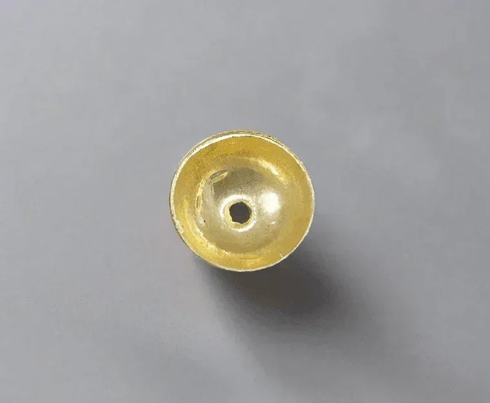 Golden jewelry bead with hollow center, ideal for elegant gold & diamond accessories