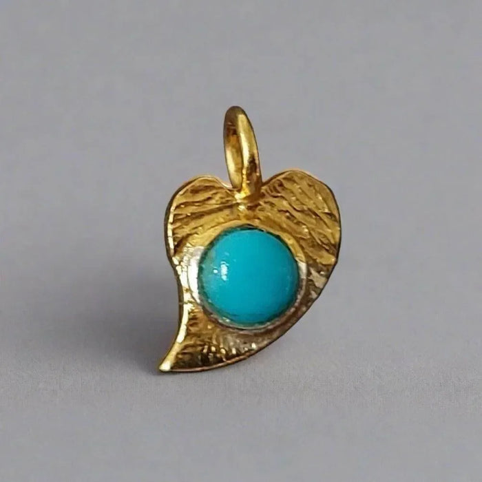 Gold leaf pendant with turquoise stone, elegant jewelry accessory