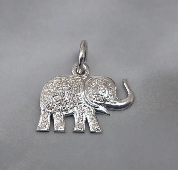 Sparkling elephant charm with diamond accents, elegant gold & diamond jewelry piece