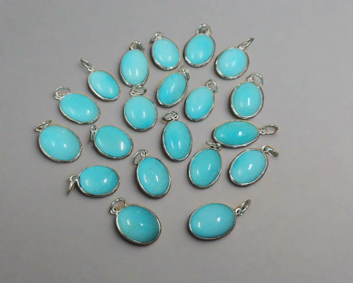 Turquoise oval pendants in silver settings, elegant jewelry accessories for necklaces or charms
