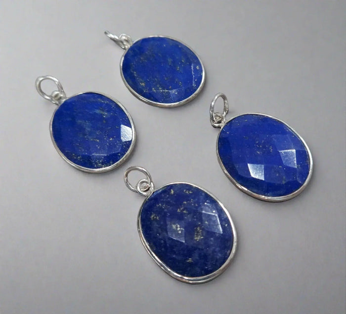 Faceted lapis lazuli pendants in silver settings, elegant blue gemstone jewelry accents