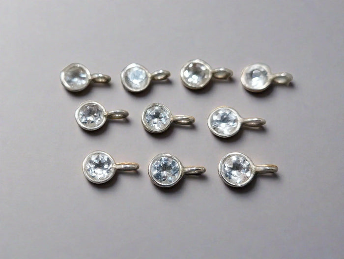 Elegant silver charms with clear gemstones, perfect for fine jewelry designs
