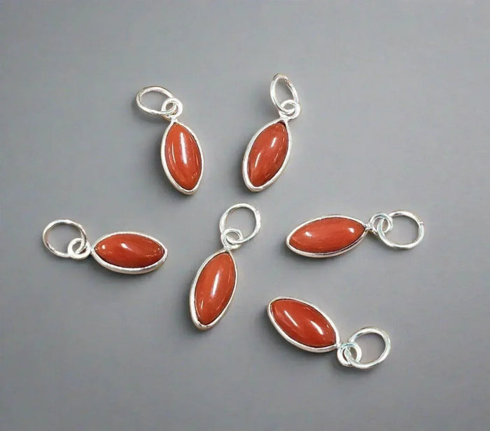 Six silver charms with oval orange gemstones, elegant jewelry accessories for necklaces or bracelets