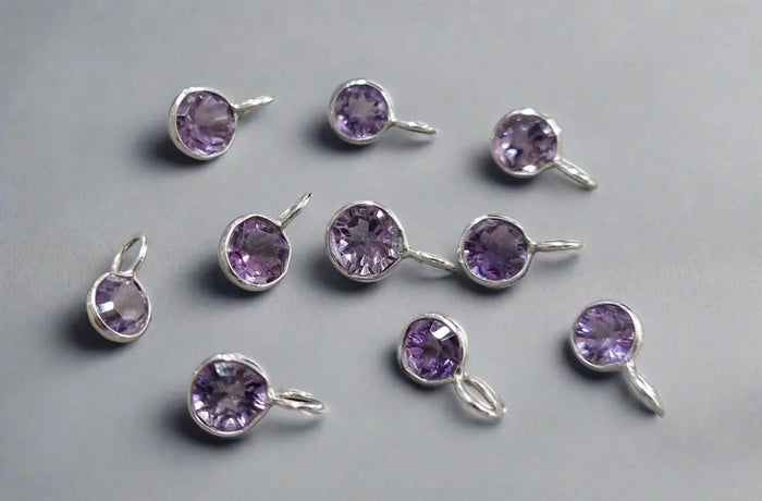 Purple amethyst gemstone charms in silver settings, elegant jewelry accessories