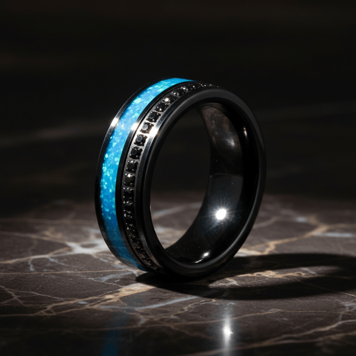 AQUORION — Luxury 3/4 angle on dark marble — men's tungsten wedding ring.