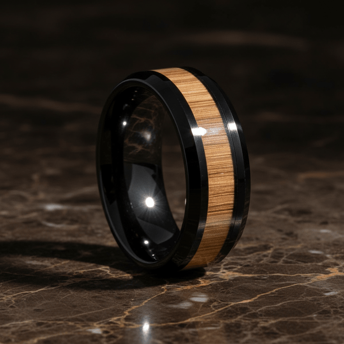 BAMBOOZLE — Luxury 3/4 angle on dark marble — men's tungsten wedding ring.