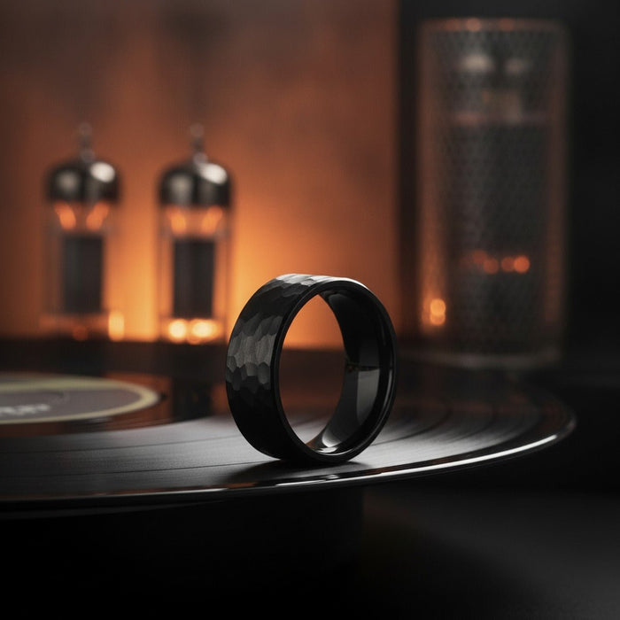 Aydins BANDIT | Black Ring, Black Tungsten Ring, Hammered, Flat lifestyle scene, vinyl record amp