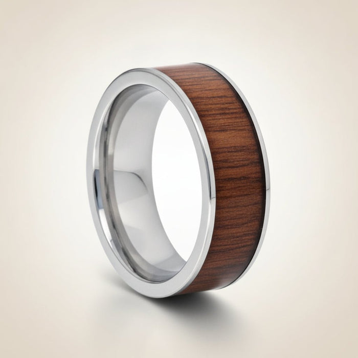 BOKKEN flat silver tungsten wedding band with black walnut wood inlay running around the band and polished silver edges, studio hero shot