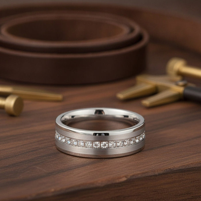 Aydins CEPHEUS | Silver Tungsten Ring, Diamond Stimulant CZ Eternity, Flat lifestyle scene, dark walnut workshop