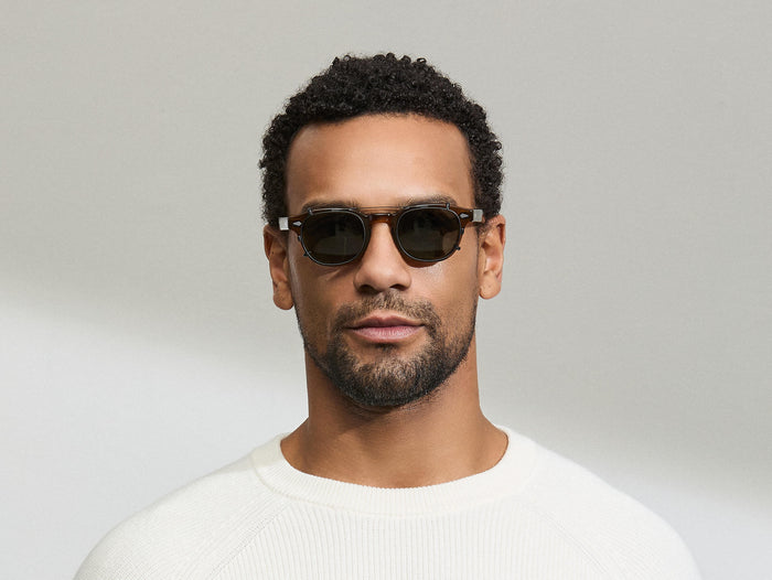 Model is wearing The CLIPTOSH POLARIZED in size 46 in Matte Black with G-15 Polarized Lenses
