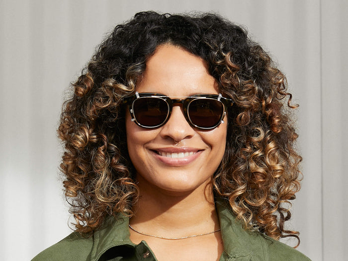 Model is wearing The DAHVEN CLIP in Gold in size 47 with G-15 Lenses