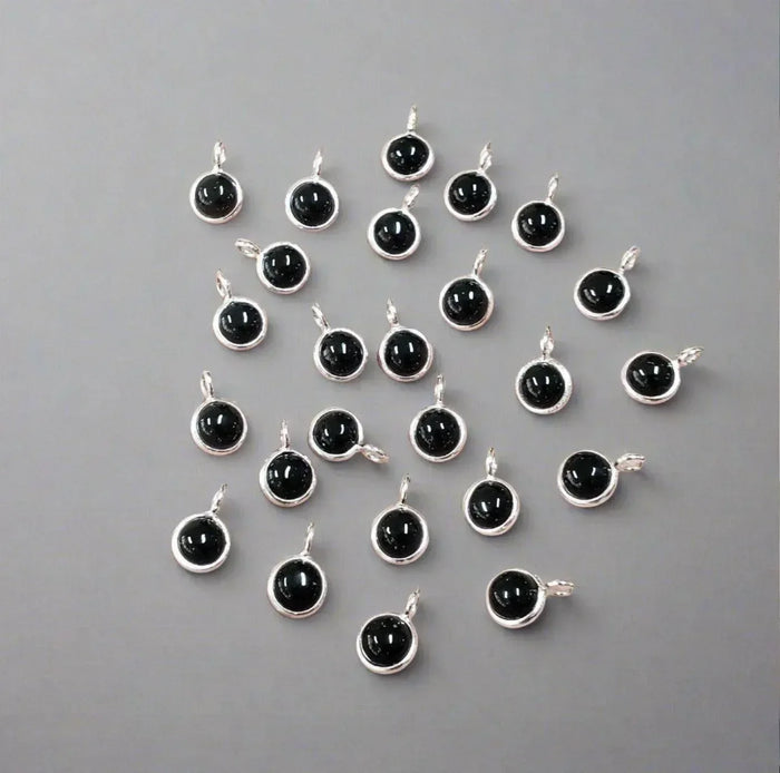 Silver pendants with black onyx stones, elegant jewelry accessories for necklaces or charms