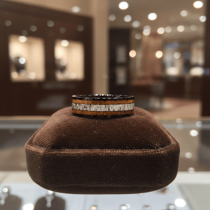 DEERWOOD — Premium boutique display on velvet — men's tungsten wedding ring.