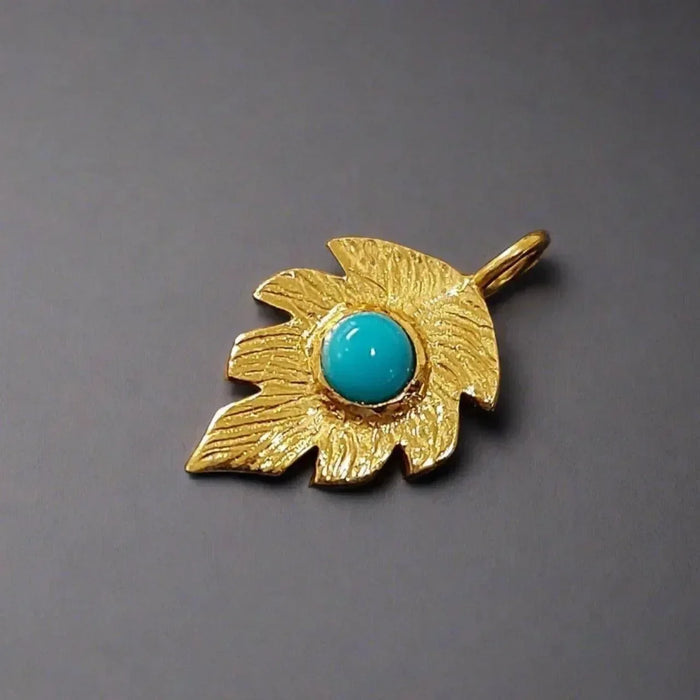 Gold leaf pendant with turquoise stone, elegant jewelry accessory