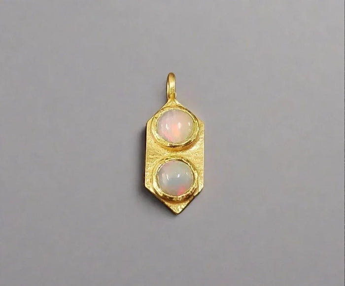 Gold pendant with two opal stones, elegant jewelry accessory