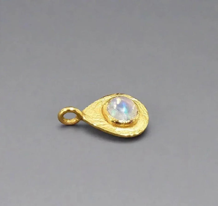 Gold teardrop pendant with iridescent moonstone, elegant jewelry accessory
