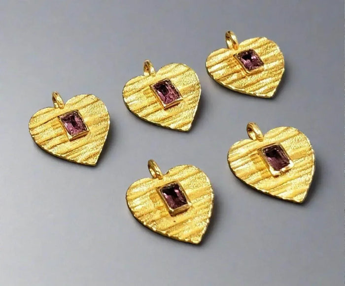 Gold heart pendants with pink gemstones, elegant jewelry accessories