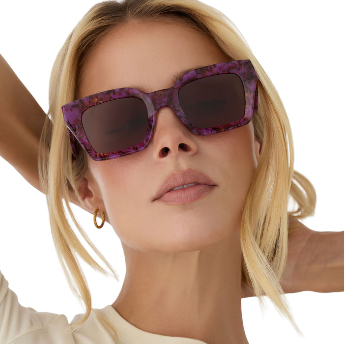 on model - blonde female wearing diff eyewear greer square sunglasses in a lavender haze tortoise acetate frame and brown lenses front view