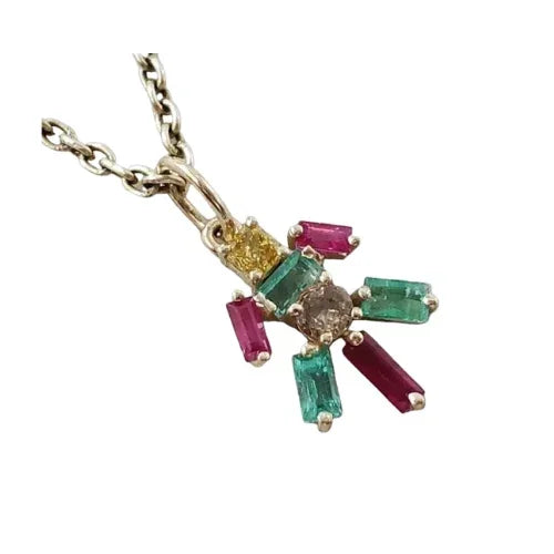 Elegant gold pendant necklace with emerald, ruby & diamond accents, showcasing luxury jewelry design
