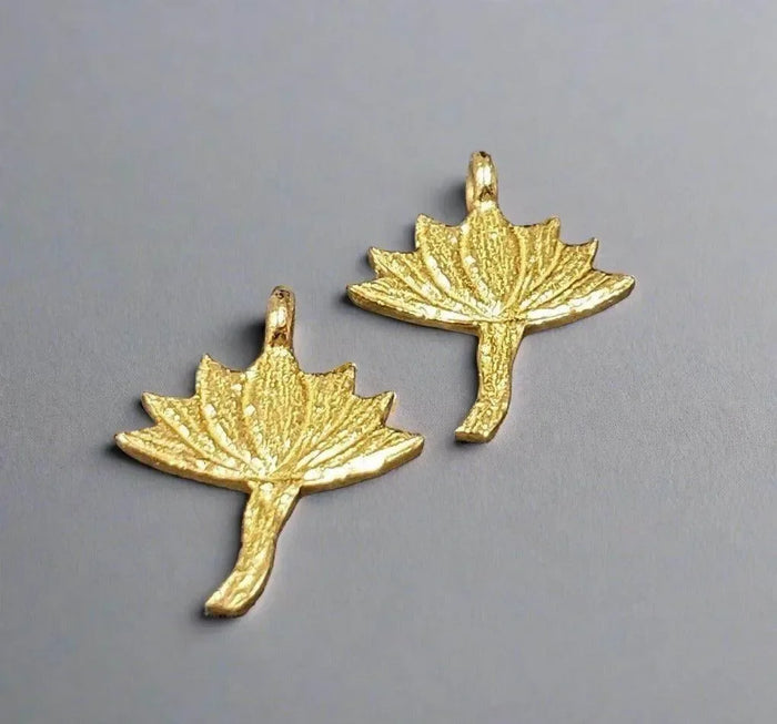 Gold maple leaf charms with textured finish, elegant jewelry accessories for necklaces or bracelets