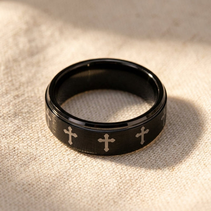 IRONLANCE brushed black tungsten laser-engraved cross wedding ring 8mm macro detail overhead flat lay