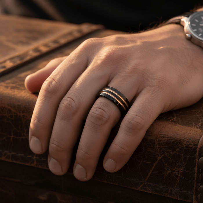 JAUCA — Lifestyle photo on hand — men's tungsten wedding ring.