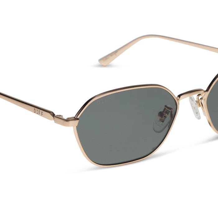 caitlin covington x diff eyewear featuring the kennedy square sunglasses with a brushed gold metal frame and g15 lenses detailed view