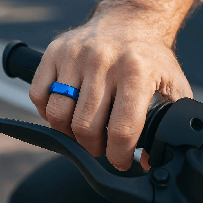 Close-up of domed surface on blue tungsten ring on Hand