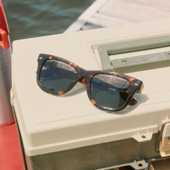 still life - diff eyewear mercer square sunglasses laying on a tackle box