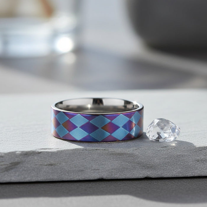 MERIDIAN flat titanium ring on slate stone with crystal, lifestyle scene