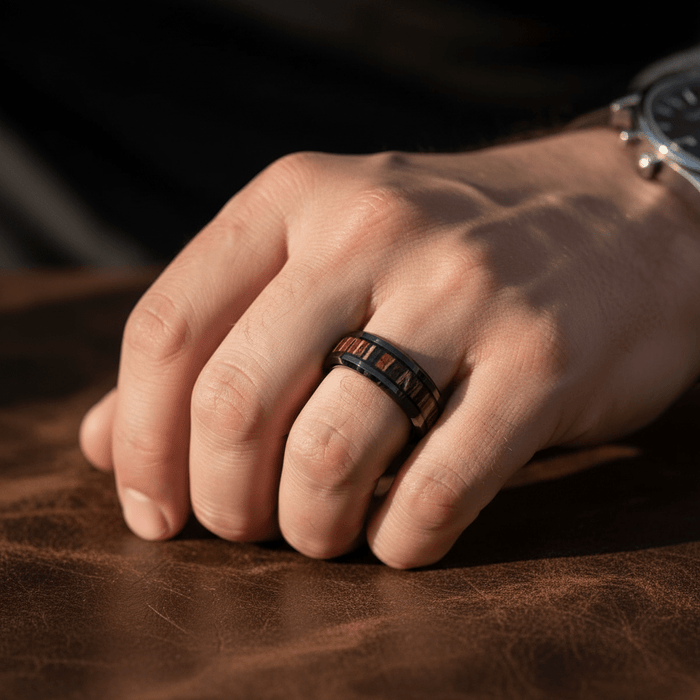 MESA — Lifestyle photo on hand — men's tungsten wedding ring.
