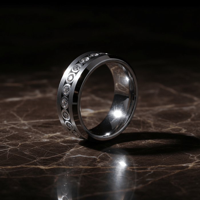 NESO — Luxury 3/4 angle on dark marble — men's tungsten wedding ring.