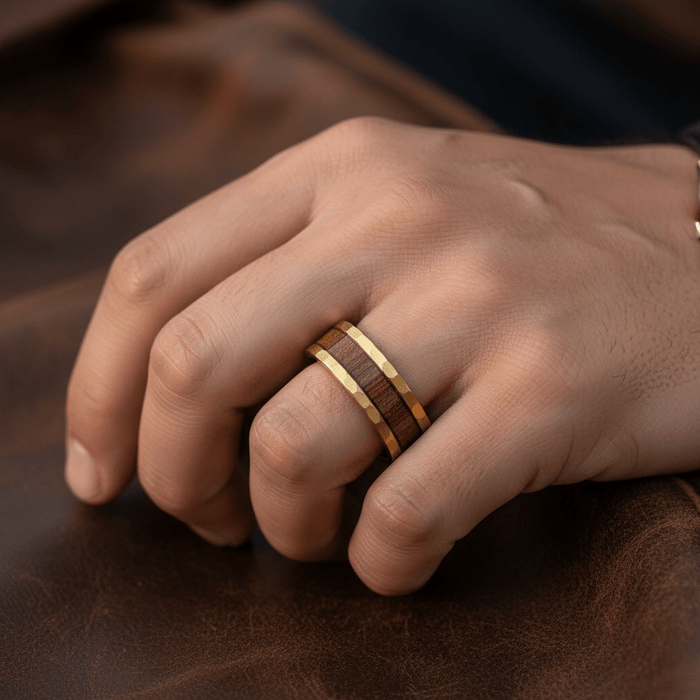 OCTANS — Lifestyle photo on hand — men's tungsten wedding ring.